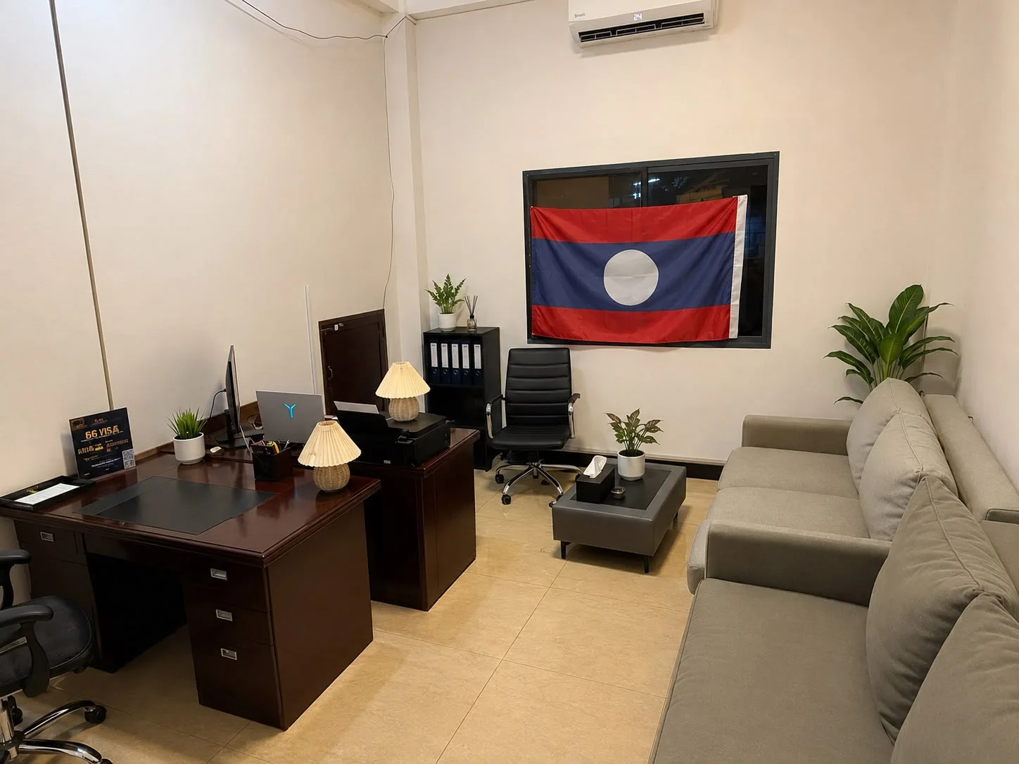 Laos Visa Center office with the Lao flag